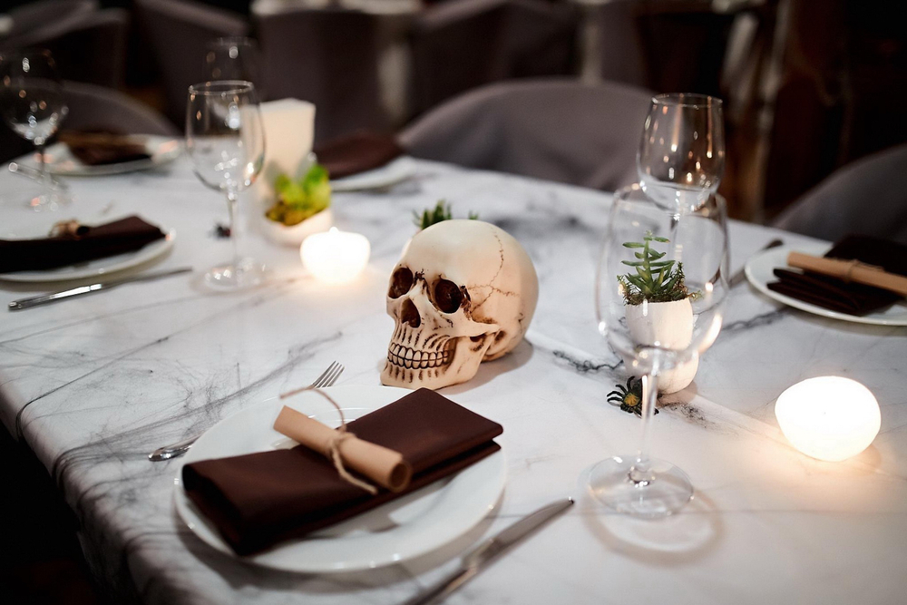a Halloween dinner table setting