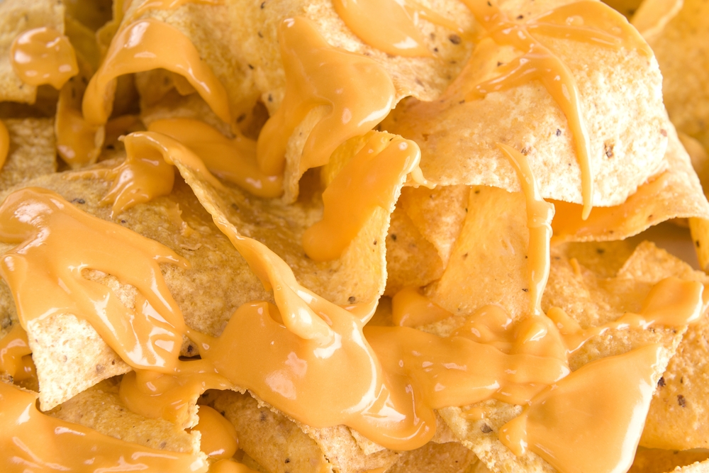 close-up of cheesy nachos on a table