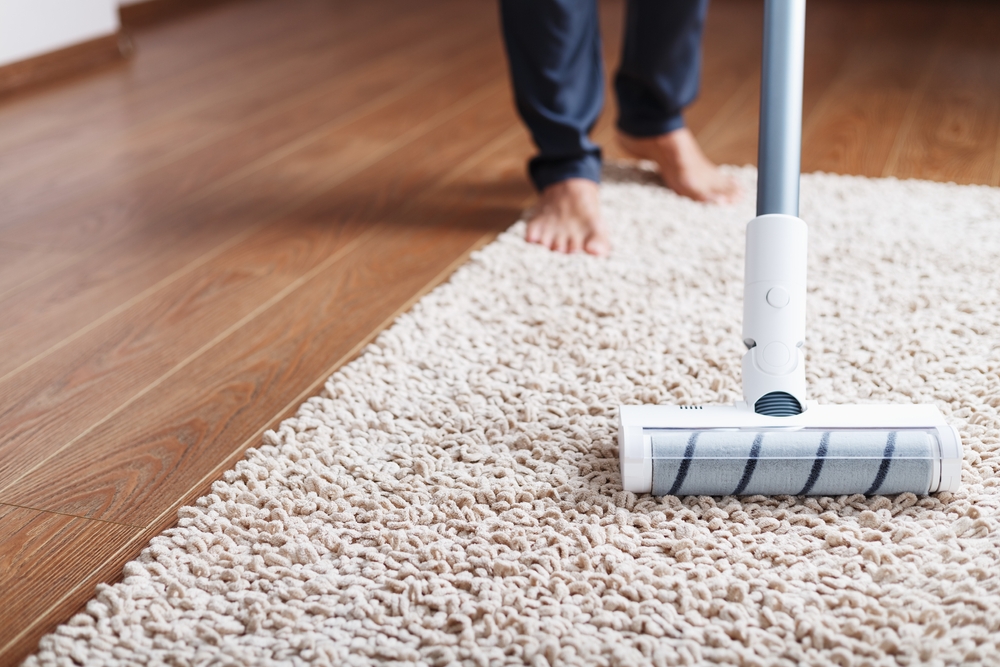vacuuming a white carpet