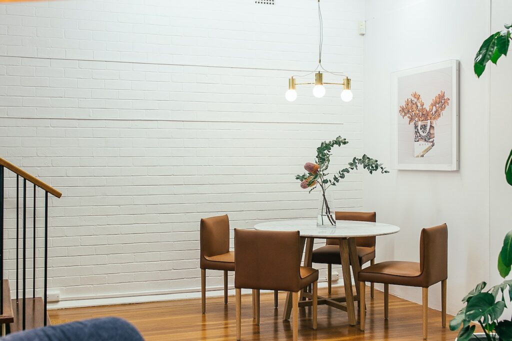 white brick wall in a dining room | tips for decorating with white