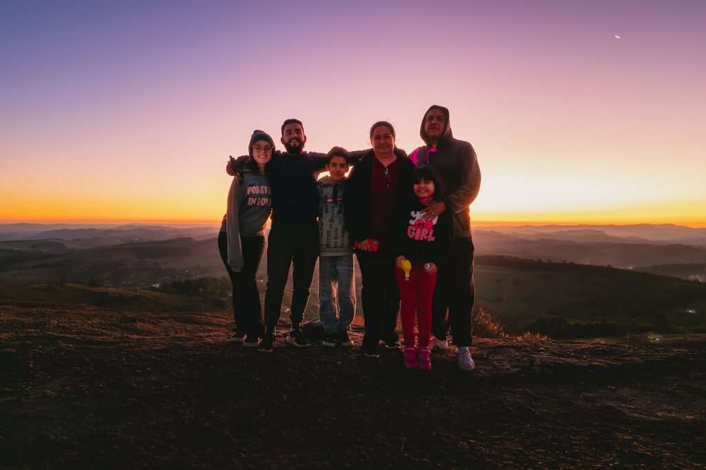 group posing on a sunset hike | daylight savings activities
