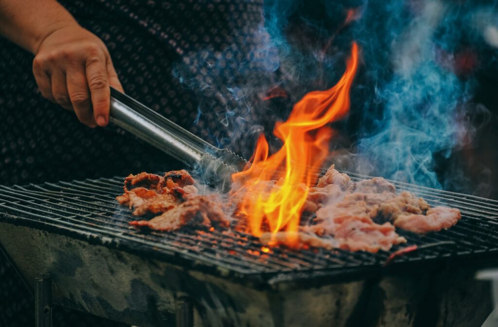 meat on a grill | must-haves for a community barbecue